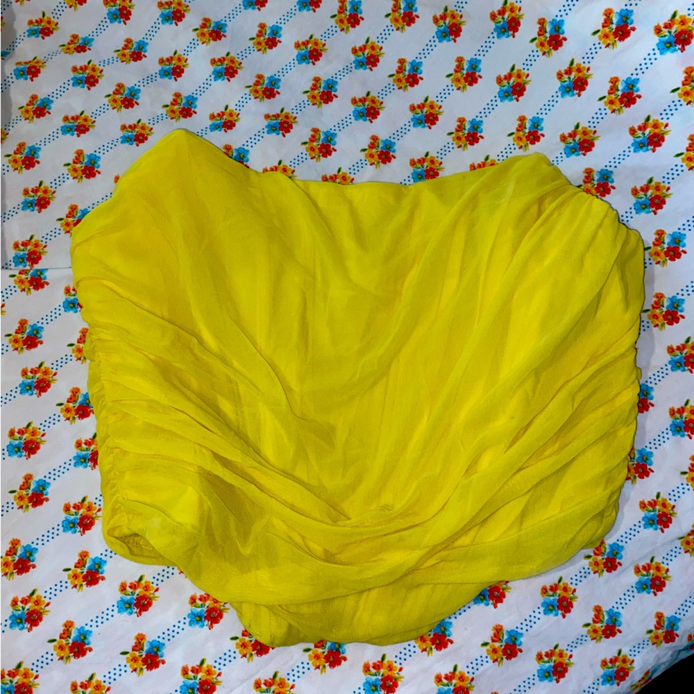 Yellow corset zip-up crop top.